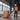 Lithium pallet truck transporting goods in narrow aisle